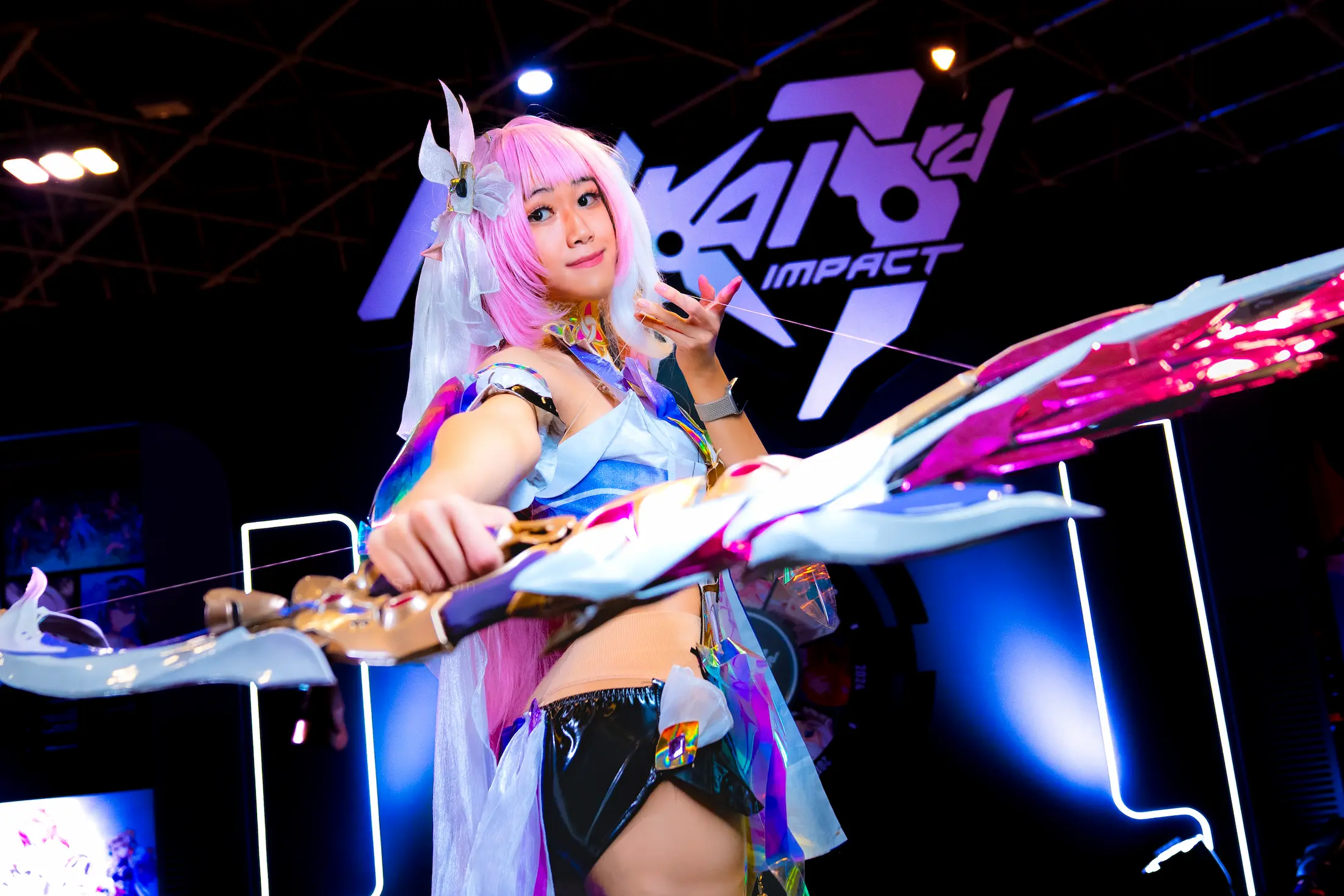 SaltyAom's Elysia cosplay holding a bow aim at the camera